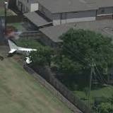 Small plane crashes into homes' backyards, no injuries