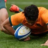 Wallabies overcome gritty Argentina but lose Quade Cooper to injury
