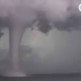 Watch: Beachgoers stunned as huge waterspout lingers in Gulf of Mexico