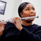 Lizzo performs onstage with James Madison's 200-year-old crystal flute
