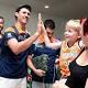 Cairns Taipans greeted by orange army on return from New Zealand 