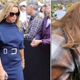 Amanda Holden pays her respects to The Queen as she visits Windsor Castle with mum and daughters...